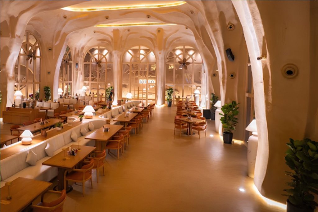 Luxury cafe and restaurant interior design showcasing premium branding experience and modern dining ambience in Ahmedabad